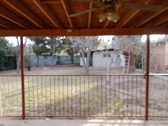 Storage and workshop in rear right. Fencing is removable. Backyard is well lit at night with motion detector lights and switched area light. Covered porch equipped with electrical plugs throughout.