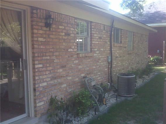 New lighted stone garden along back of house