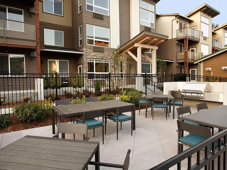 Courtyard with barbecue grills and dining area