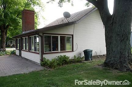 Enclosed porch with fireplace
						:
						New windows.