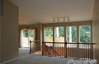 Great room and adjacent diningroom which leads out to the deck.