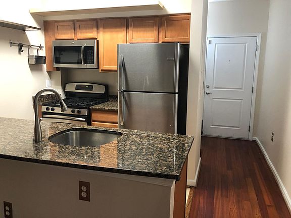 Kitchen with stainless steel appliances and brand new refrigerator! Tons of storage!