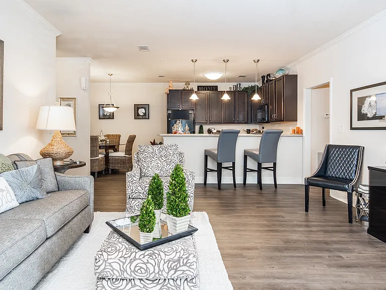 Open-concept living room with view of kitchen and dining area