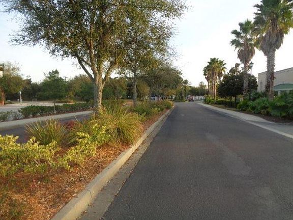 Herons Landing Condos are accessed by the short nicely landscaped road pictured directly off of Beach Boulevard at a stop light.