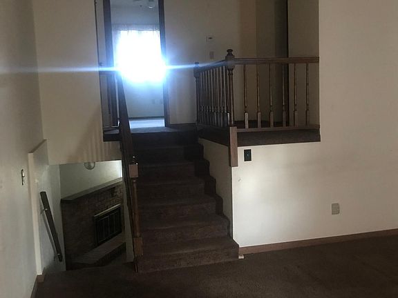 Main level has living room, dining area, kitchen