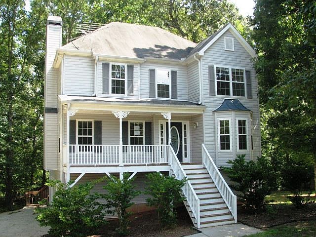 Lovely two story on a partial basement with 2 car drive-under garage