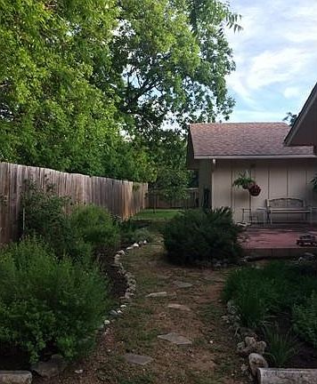 Landscaping in back of house. Fragrant rosemary and other herbs.