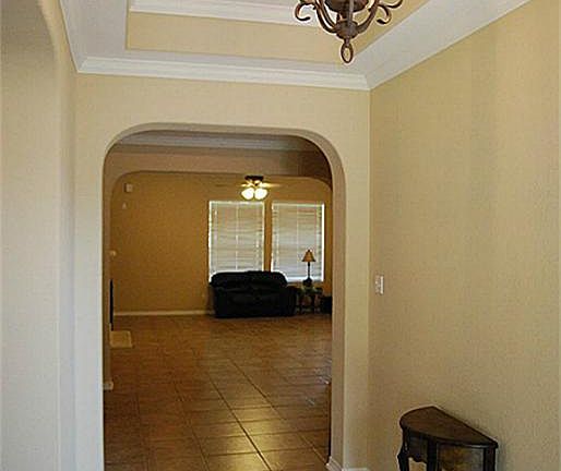 IMPRESSIVE FRONT ENTRANCE WITH DIAGONAL PORCELAIN TILE.