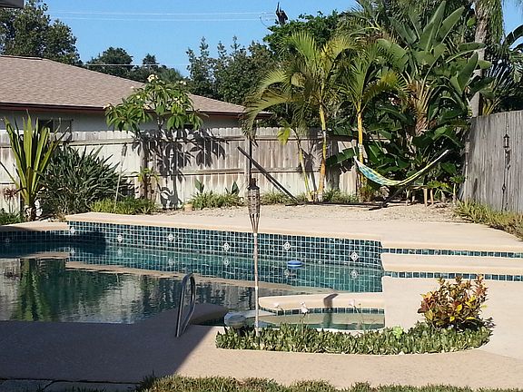 Beach area behind pool