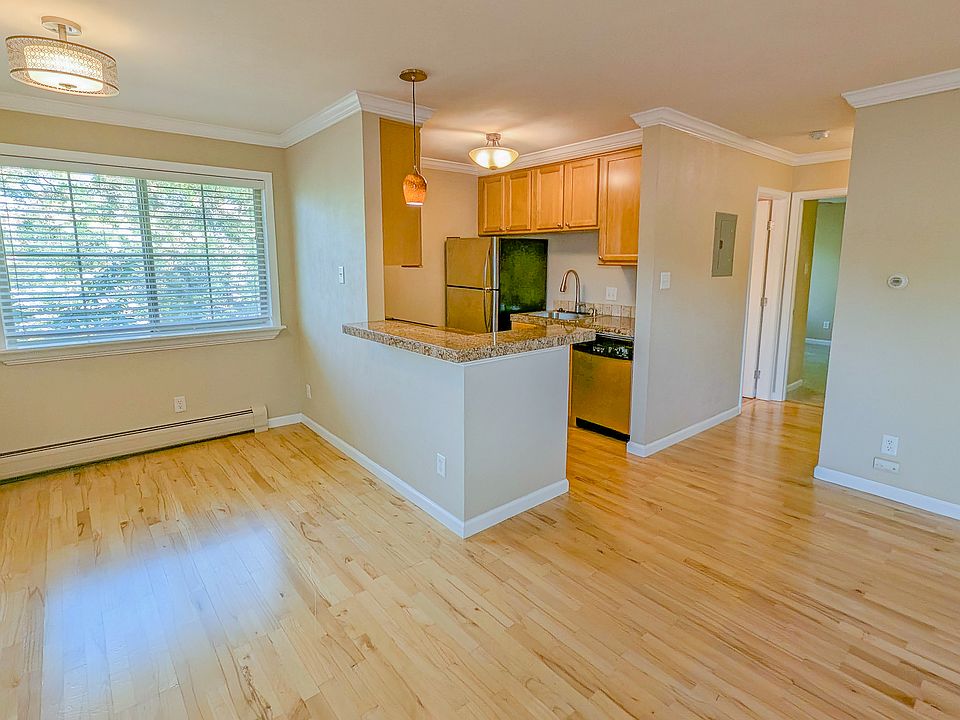 Open concept entryway, family room and dining room