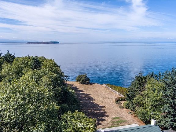 This is the view of the back patio out to the bluff, where the birds play and the sunsets shine.