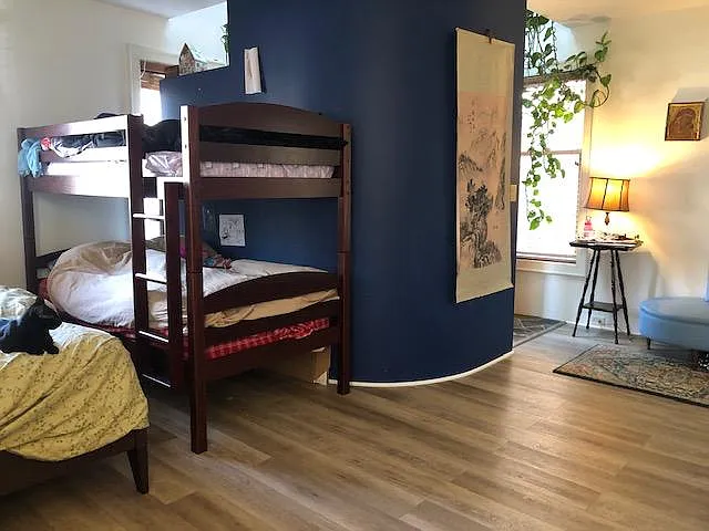Cosy sleeping area is nestled in behind the curved wall.