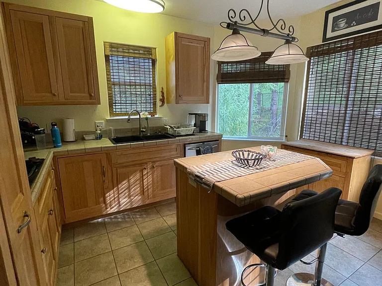 Kitchen with Island, stainless steel appliance and 4 windows for lots of natural light