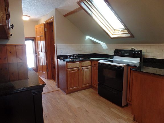 Updated kitchen with newer appliances, granite and skylight.