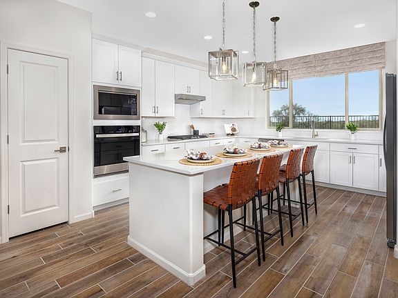 Enjoy plenty of seating and counterspace at the large kitchen island.