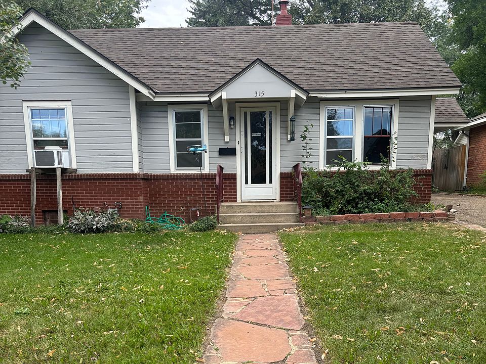 Home is set in a very quiet neighborhood in old town Longmont. It faces east for the morning sun, A single carport is on the left
