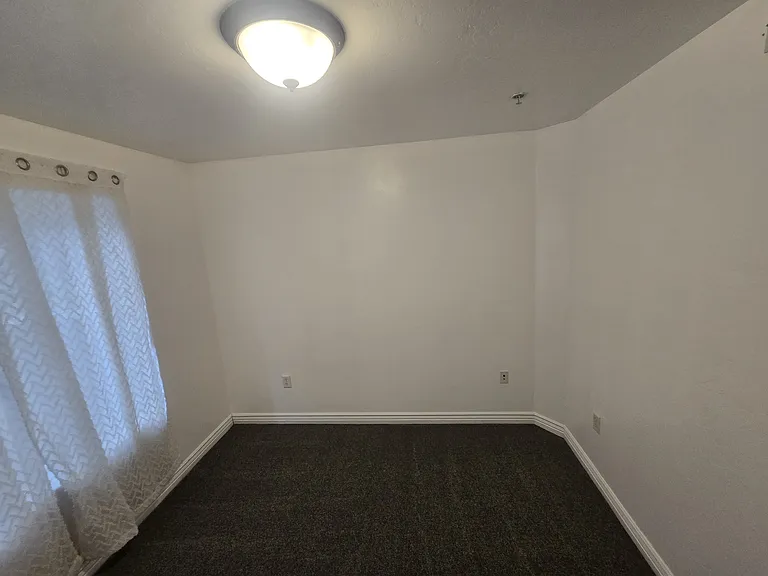 Bedroom 1, complete with new carpet and fresh paint.