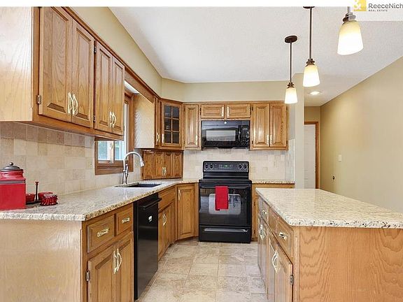 Large kitchen with granite counters & island.