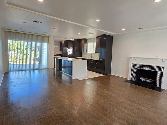 view of the living room and kitchen upon entry from front door
