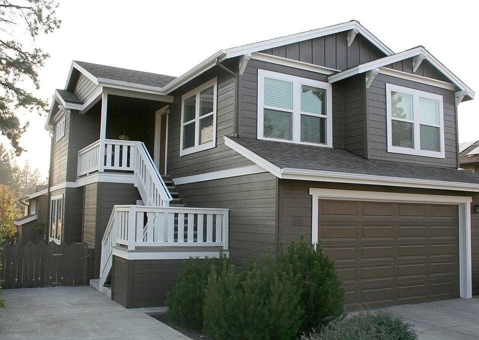 Exterior with parking space. Unit above garage.