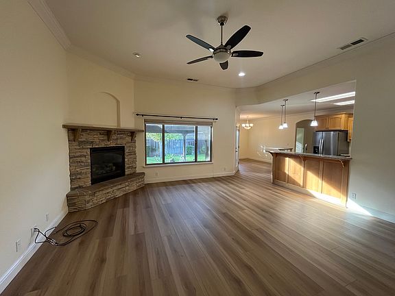 Living room with gas fireplace.
Open Kitchen and dining room on the right.