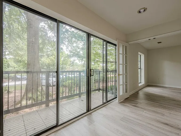 Empty room with light wood-type flooring, french doors, and recessed lighting