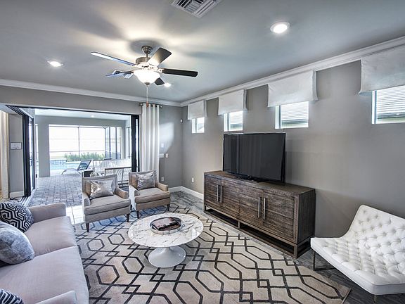 Model Representation; Spacious gathering room with lots of natural light and easy lanai access