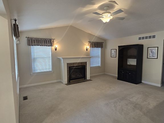 Living Room with Gas Fireplace and Ceiling Fan