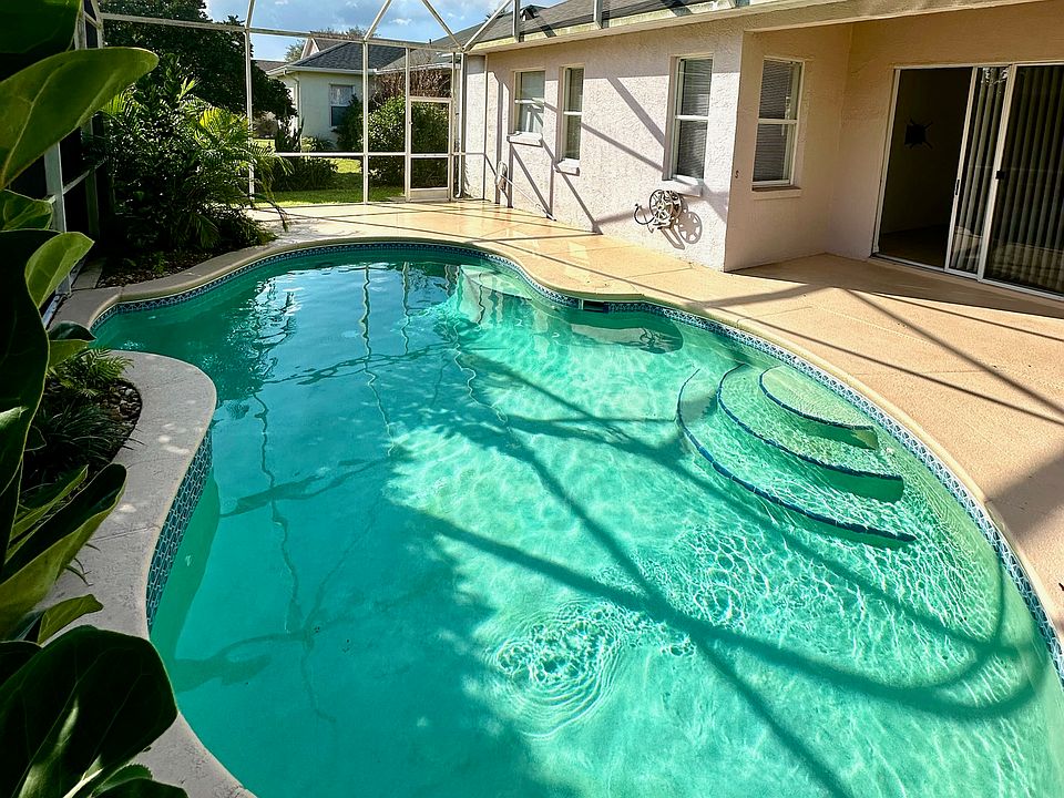 Outdoor pool and pool enclosure