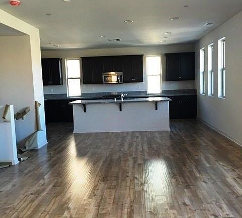 wood floors and rich maple cabinets