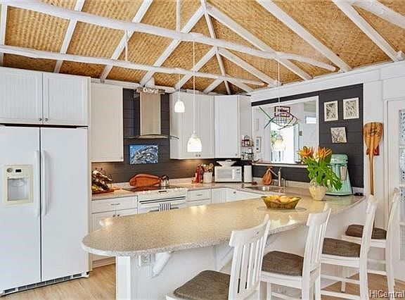 The kitchen was remodeled in 2007 and has a generous bar area for eating or entertaining! There is even a pass through window to the right.