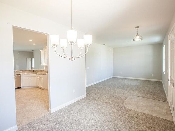 Versatile dining room and den off the entry foyer - New home for sale in Auburndale, FL