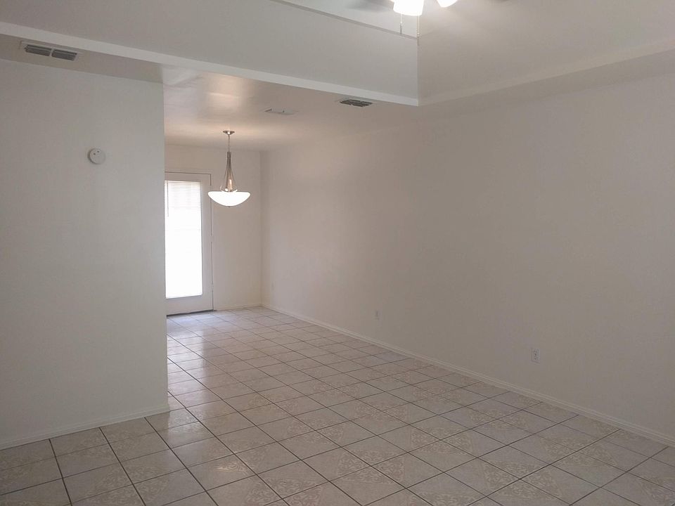 View of the living room and dining room from the front door.