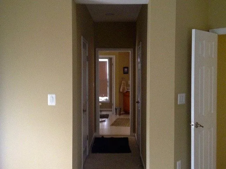 Master His & Her Walk-in Closets on both sides of the hallway