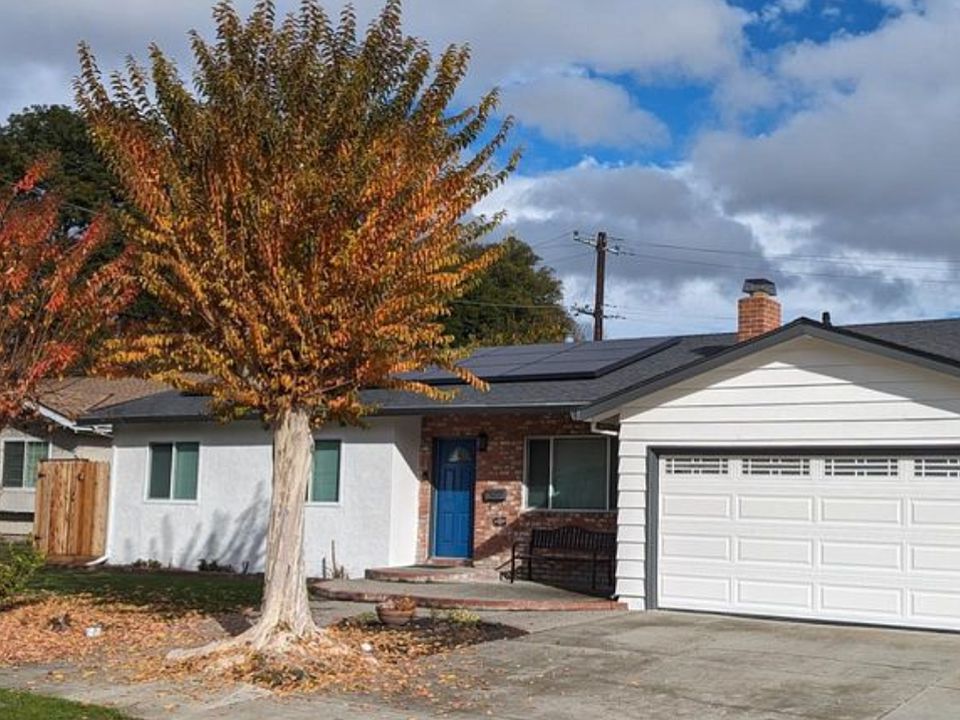 Freshly painted exterior with new insulated garage door.