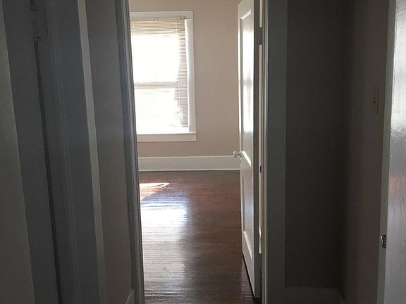 hallway leads into bdrm