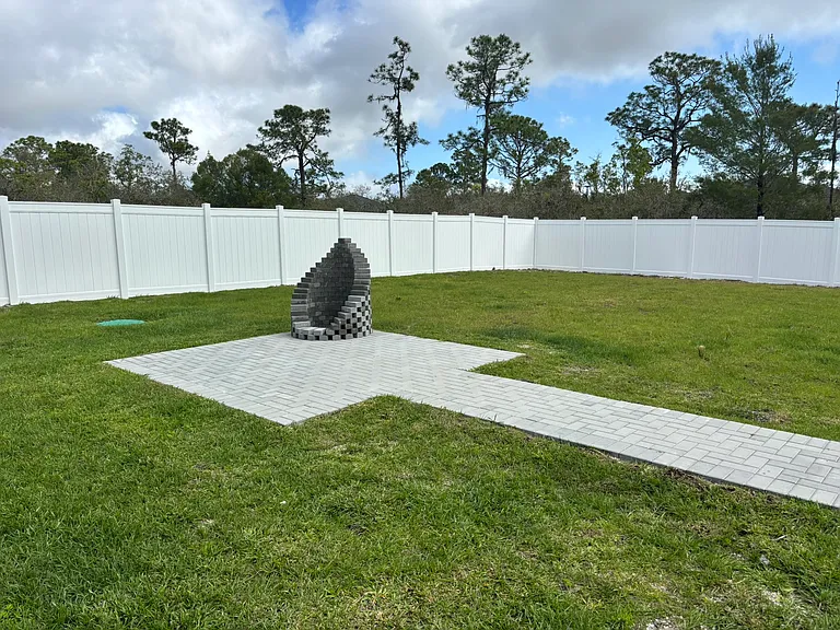 Private fenced-in backyard with a firepit_perfect for evening gatherings and outdoor relaxation.