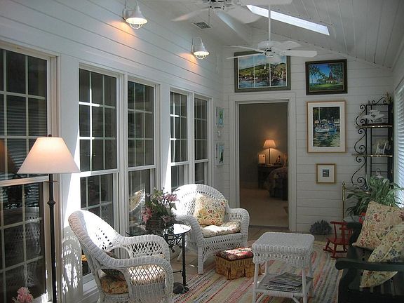 sun porch looks out onto the back yard