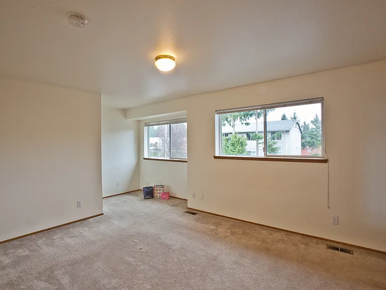 large primary bedroom suite with sitting area