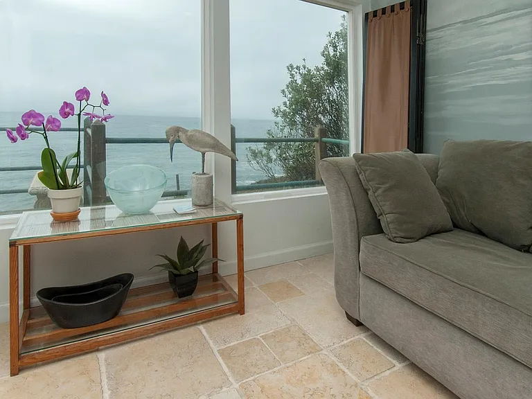 Sun room has fold-out couch, 2 walls of windows makes for great ocean views