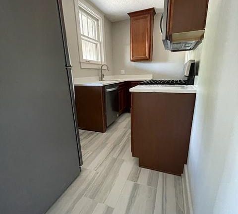 The flooring, cabinets and countertops are similar in the remodeled apartments.