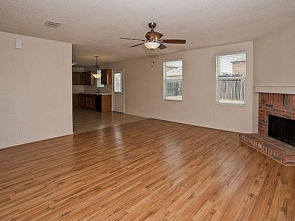 You can relax and enjoy the wood burning brick fireplace in the second living 