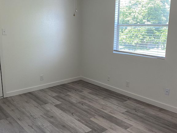 Bedroom 1 with ceiling fan, 2 closets and access to private balcony