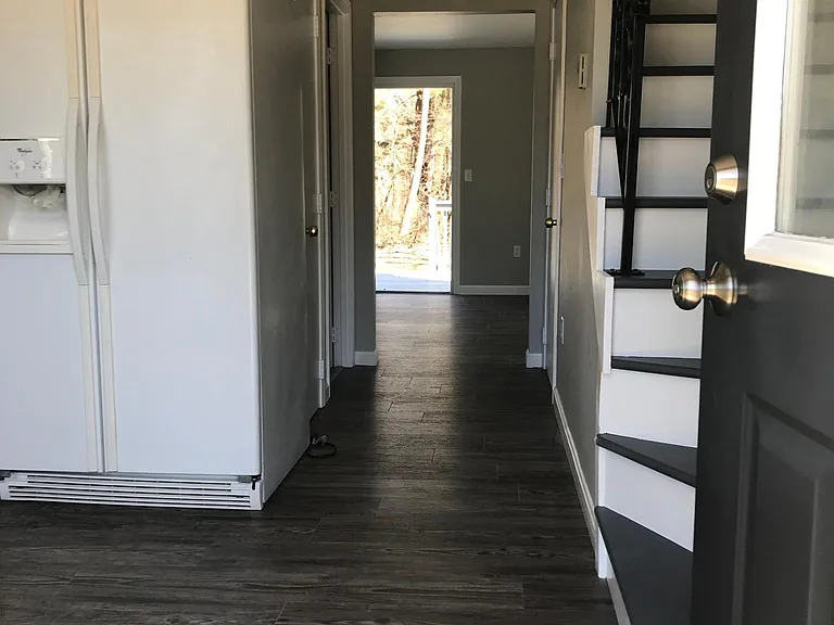 Entry, coat closet to the right, kitchen to the left