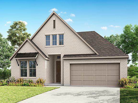 A two-story house with a gabled roof, a garage, and a well-manicured lawn surrounded by lush greener