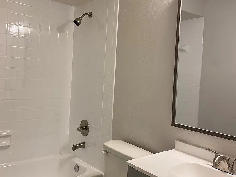 Full bathroom with tub/shower combo.