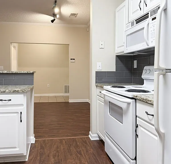 Kitchen opens into the dining area.