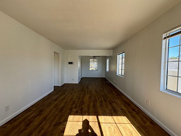 Living area with dining space. View standing from front entry door.