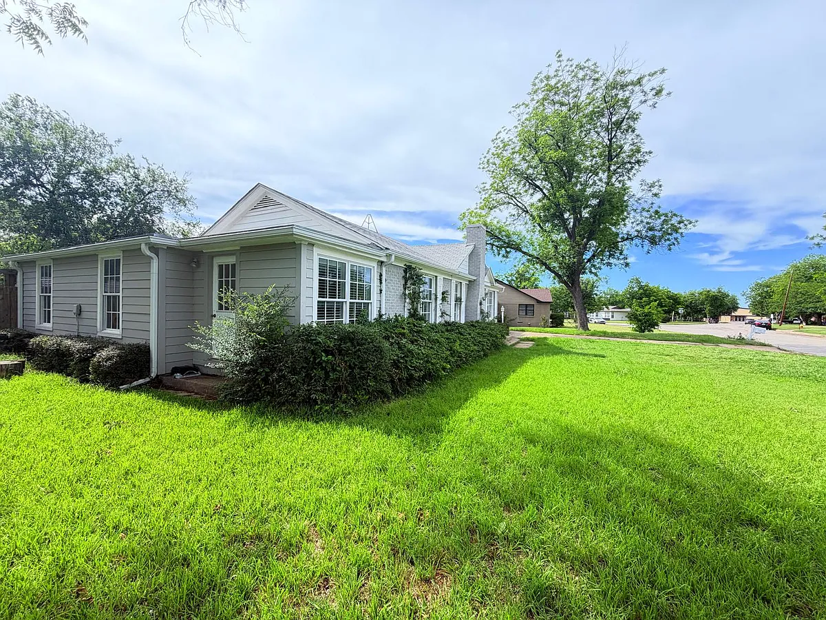 Extra entrance on side of house. Also you can see Graham High School from the font yard. - 1020 Hillcrest Dr