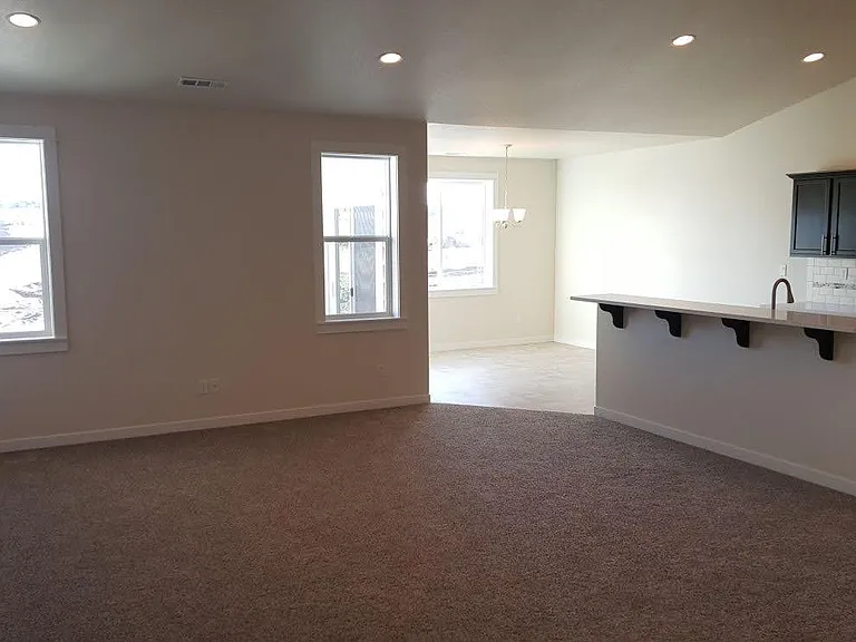 Living and dining areas (photo taken before the construction of house behind)